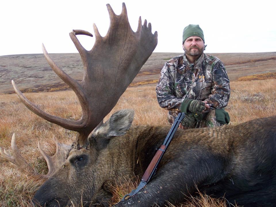 John Wilson with a moose in Alaska
